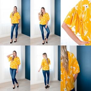 Beautiful yellow bell sleeve blouse.